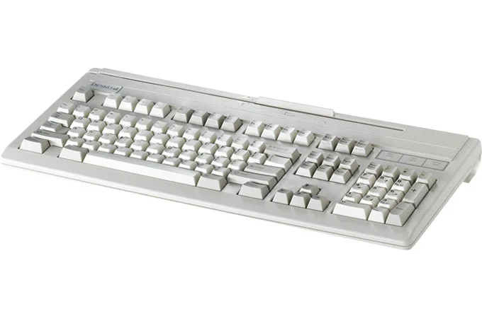 Teclado de seguridad de color claro de DESKO con lector de tarjetas integrado, dispositivo de entrada robusto para aplicaciones sensibles.